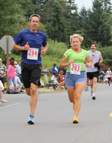 People running in a marathon for health and fitness